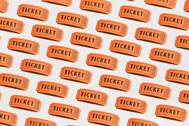 Orange tickets lined up in rows