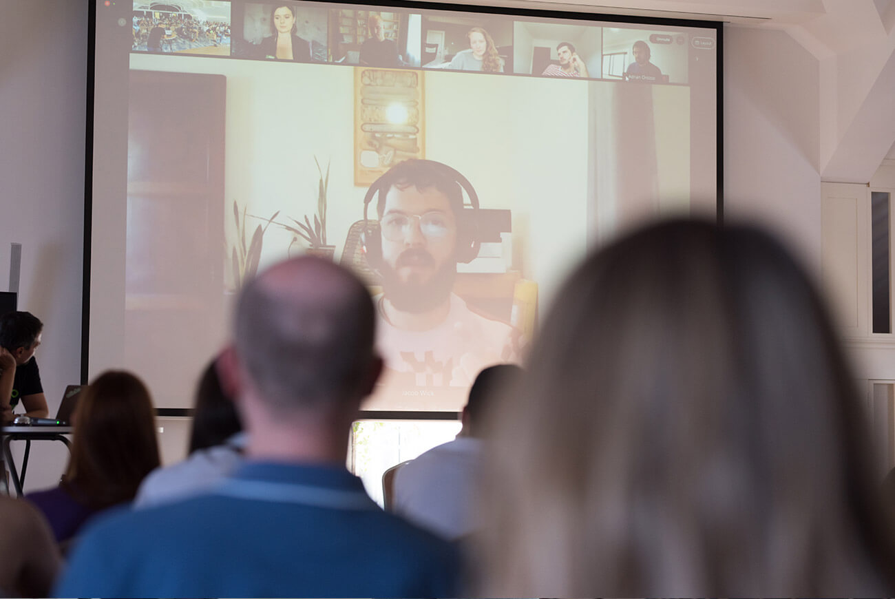 A photo of a remote-working Slido employee presenting at Slido's hybrid company offsite